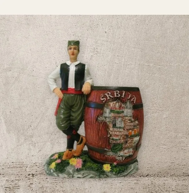 Man with barrel figurine